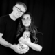 Parents holding their newborn during a professional newborn photoshoot